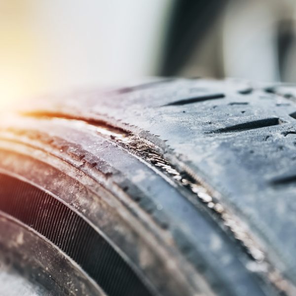 Closeup of old car tire with cracks